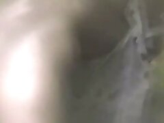 Brunette gets naked flashes in tall grass outdoor