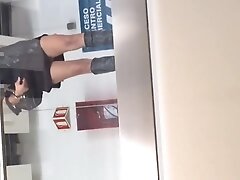 Standing next to the barander with no panties. Upskirt flash
