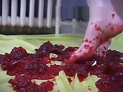 Girl gets feet messy with jello