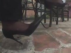 Женские ноги, Фетишисты Babe in black nylons dangles her high heels to show off her pantyhose feet